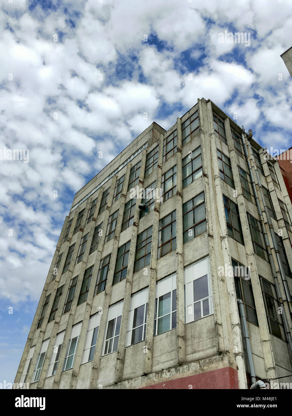 abandoned industrial building under dramatic sky Stock Photo