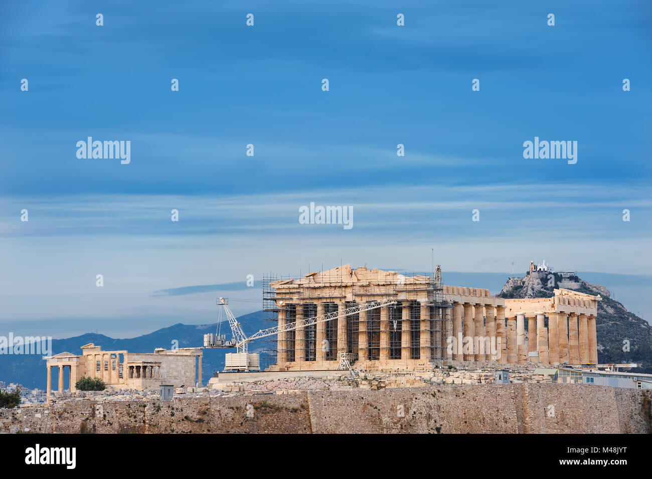 acropolis in rays of sunset Stock Photo