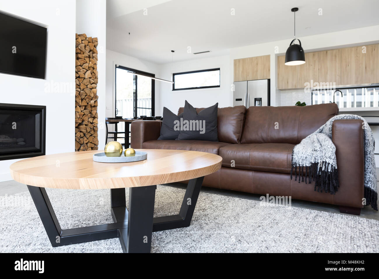 Luxury living room with leather sofa and oak coffee table Stock Photo