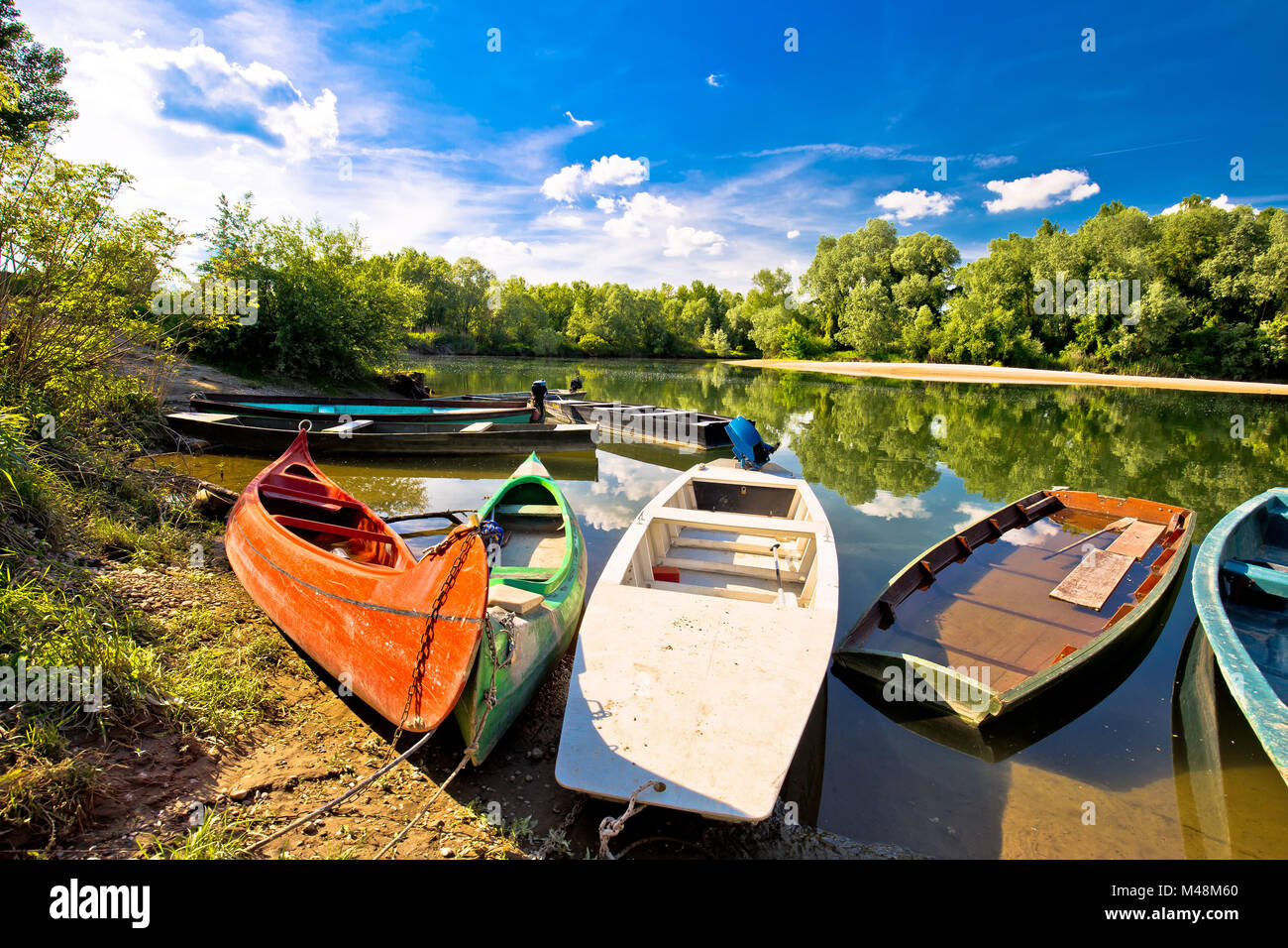 Colorful boats on mouth of Drava and Mura rivers Stock Photo