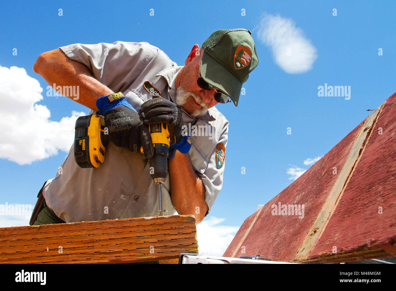 Larry Davis installing a new sign. Stock Photo