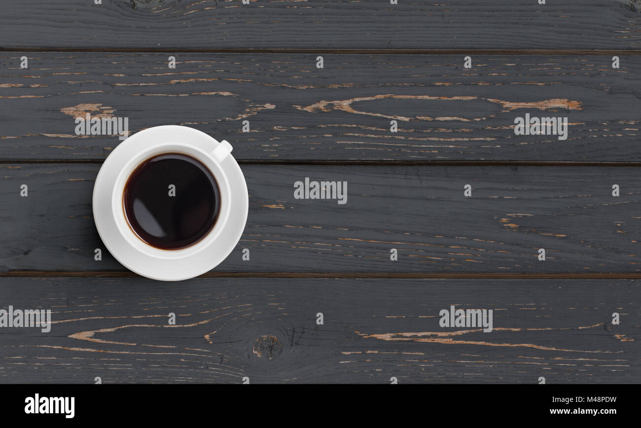 Black coffee cup on black wooden table top view Stock Photo