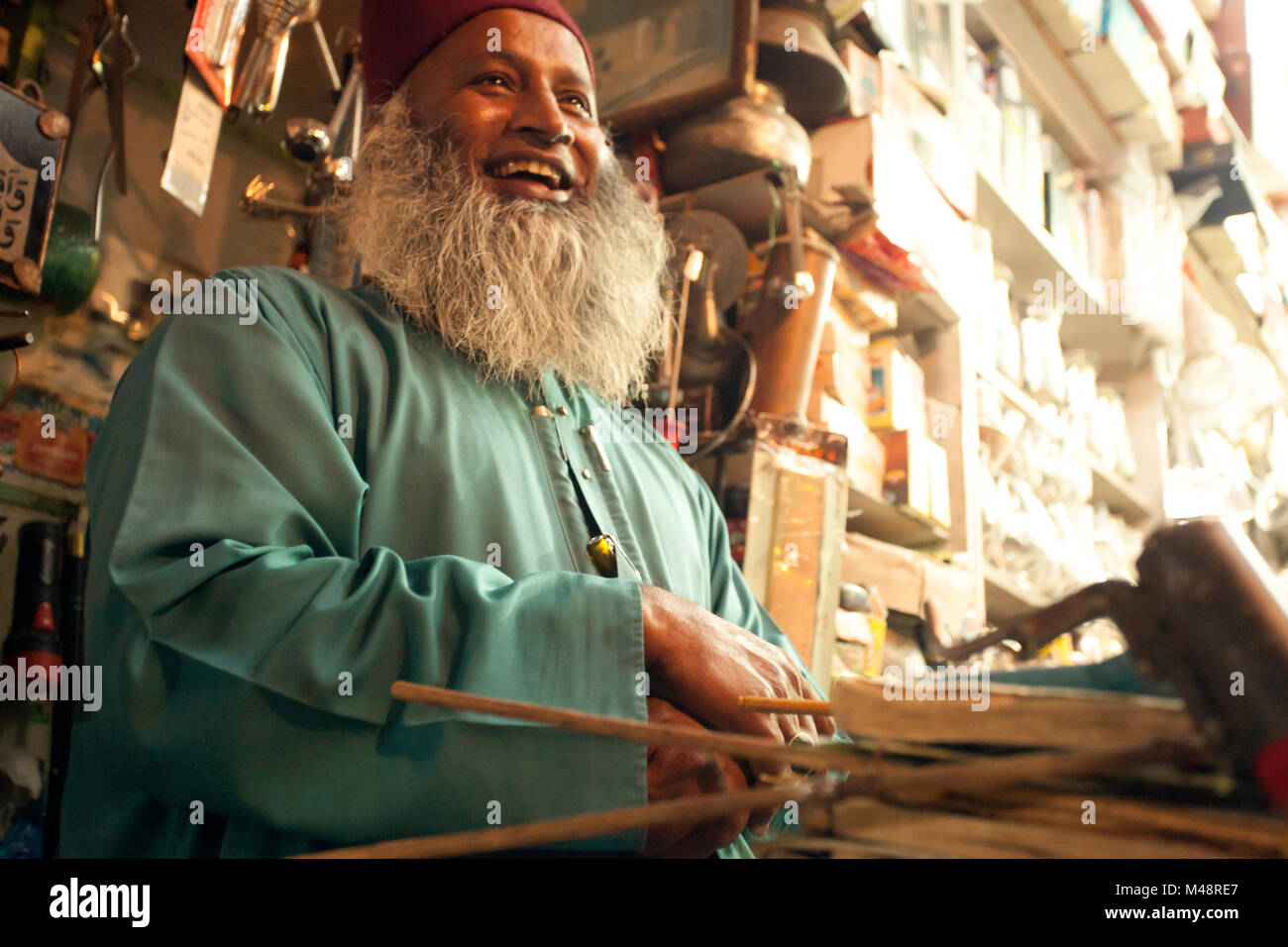 An old muslim man selling steel and brass vessels in Charminar, Hyderabad. Stock Photo
