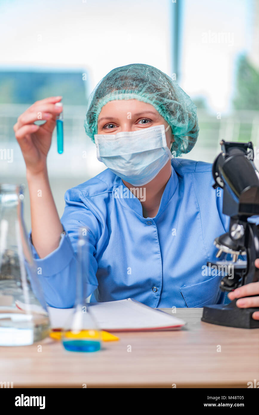 Experienced lab assistant working on chemical solutions Stock Photo Alamy
