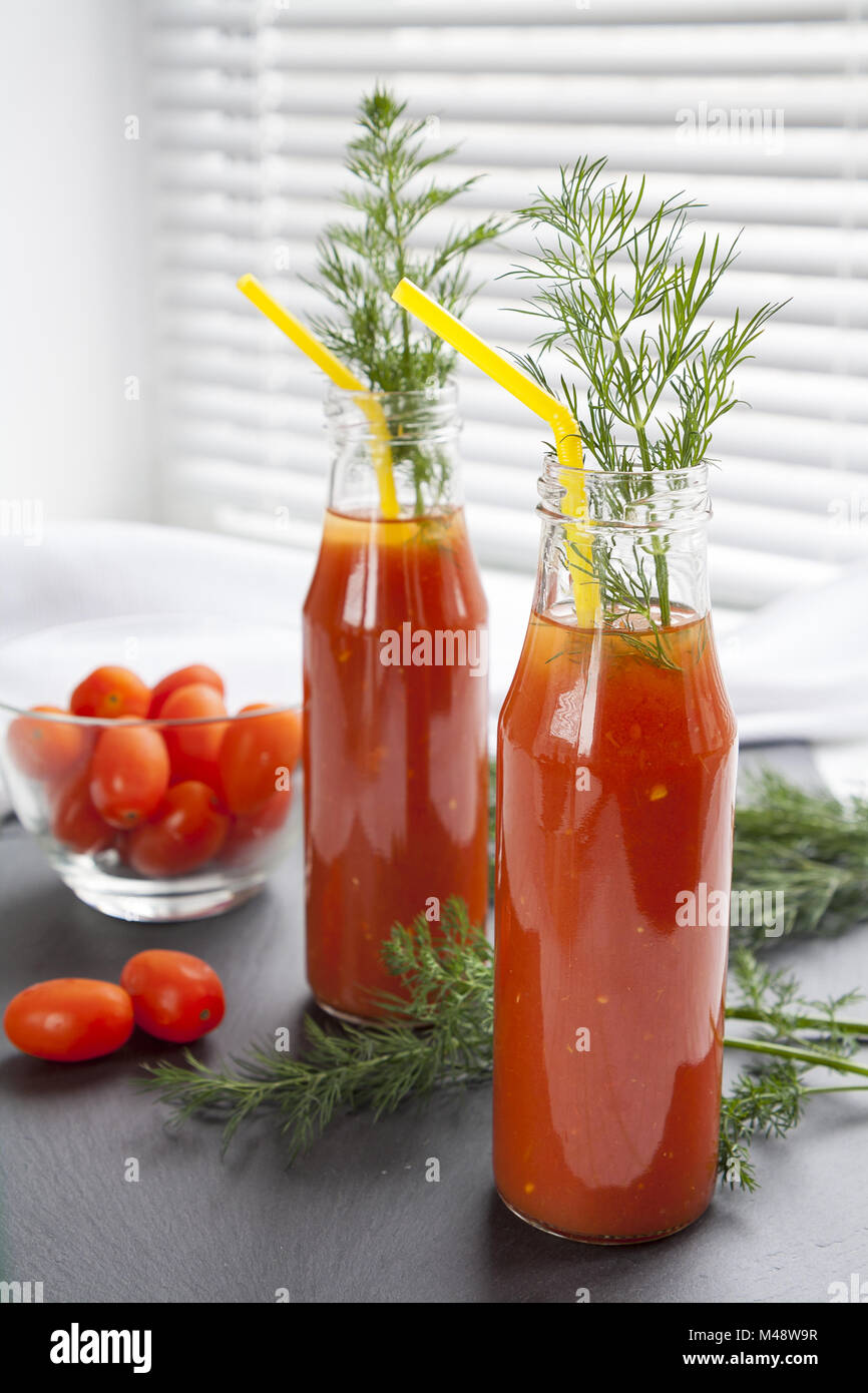 Natural and fresh tomato juice in small bottles Stock Photo Alamy