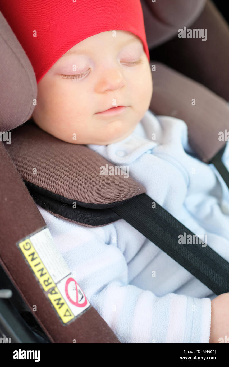 Baby sleeping in car seat Stock Photo Alamy