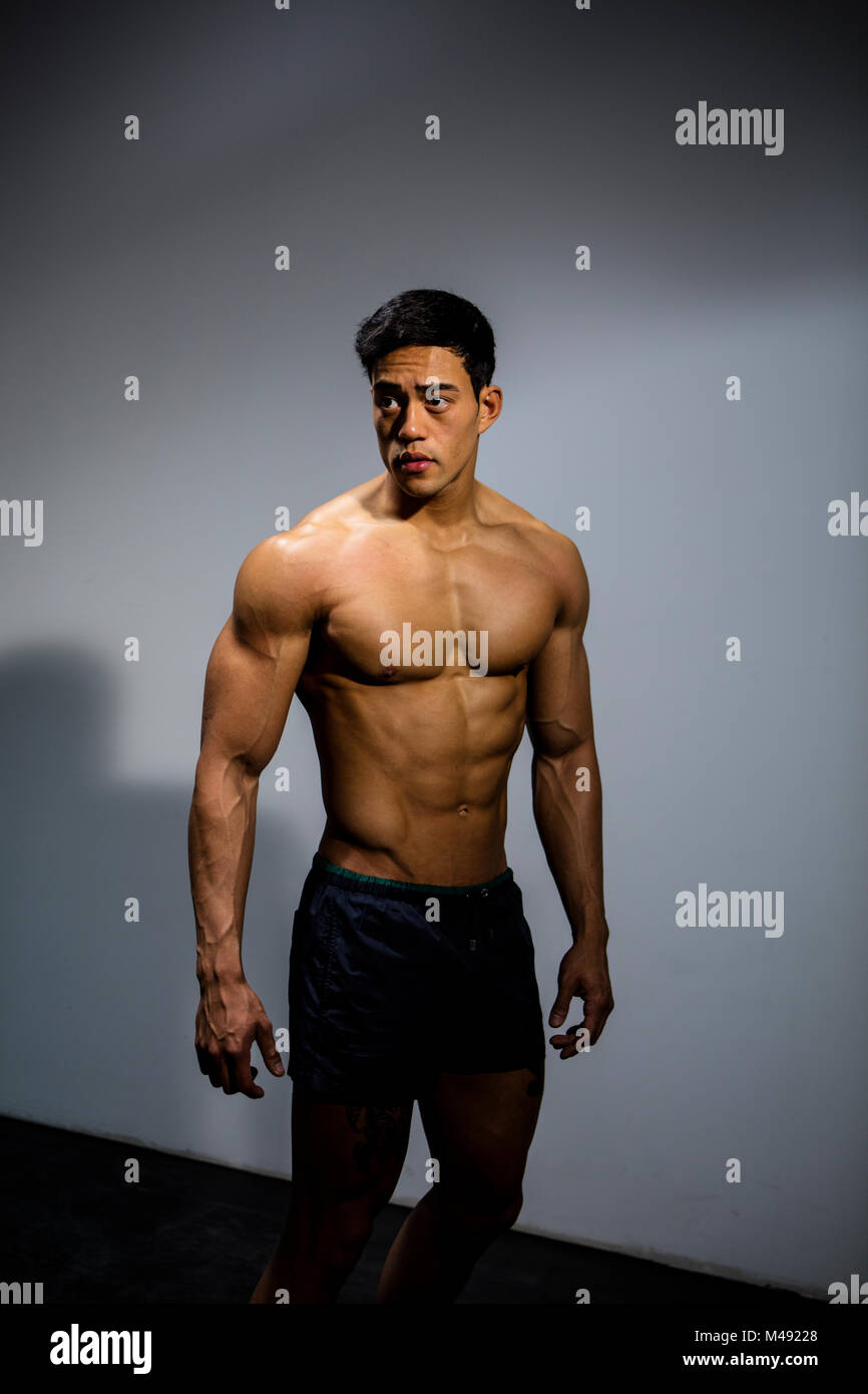 An Asian fitness model full body shot looking directly at the camera Stock  Photo - Alamy