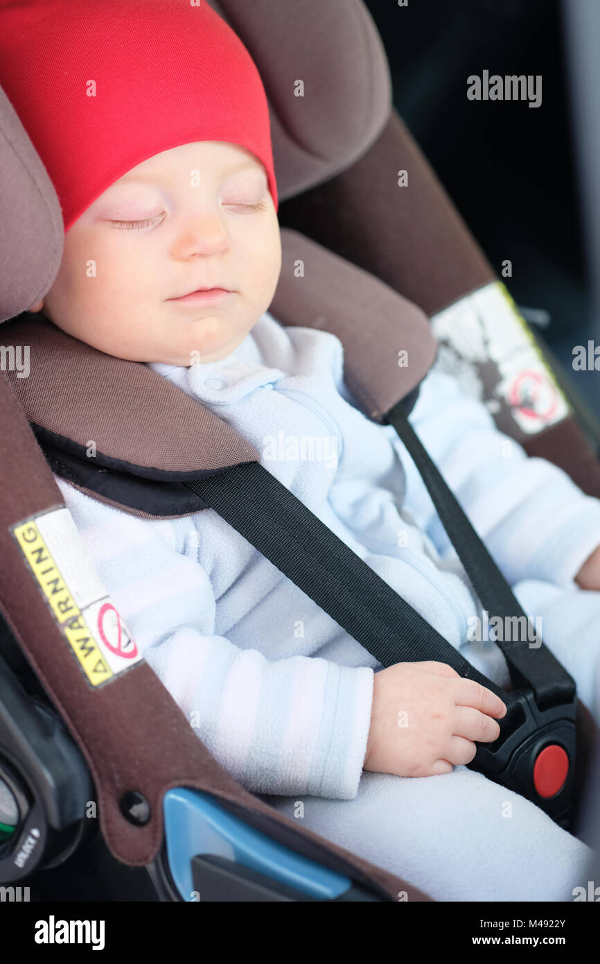 Baby sleeping in car seat Stock Photo