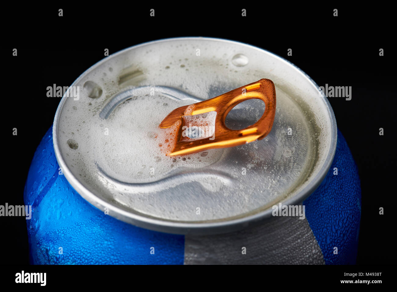 Close-up of beer foam on metal open tin can Stock Photo