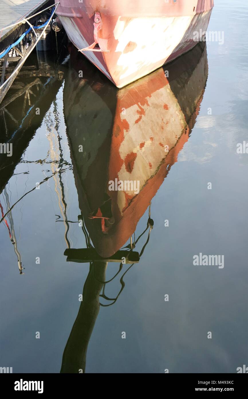Boat reflected in water Stock Photo - Alamy