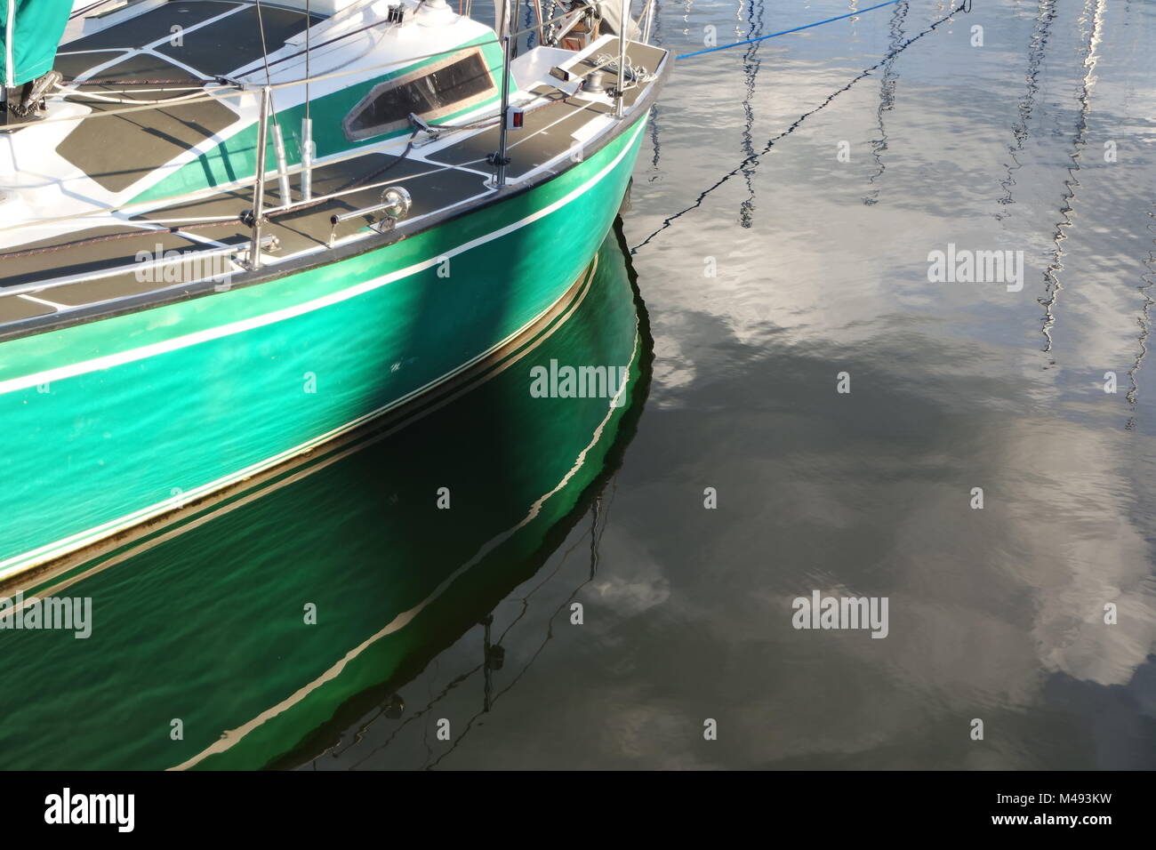 Boat reflected in water Stock Photo - Alamy