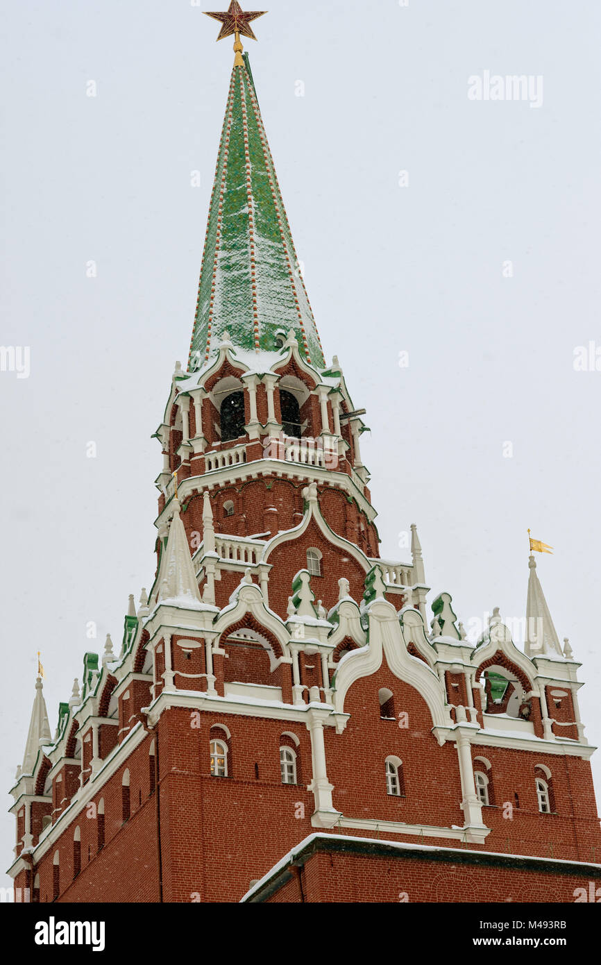 Troitskaya, Trinity, tower of Moscow Kremlin, topped with a red star in winter. This tower gates serve as the main tourist entrance to the Kremlin Stock Photo