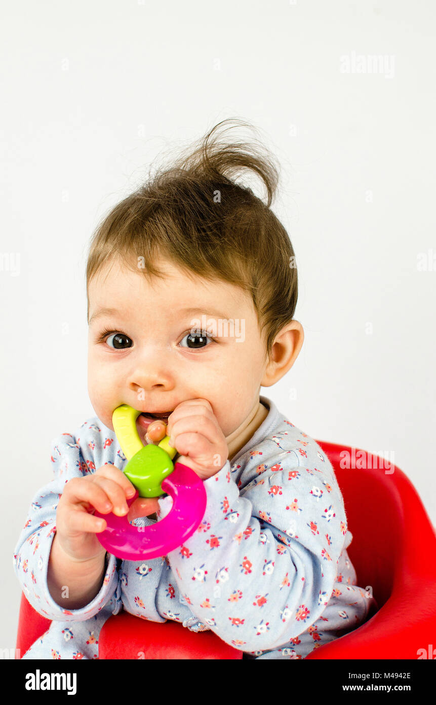 teething baby girl Stock Photo
