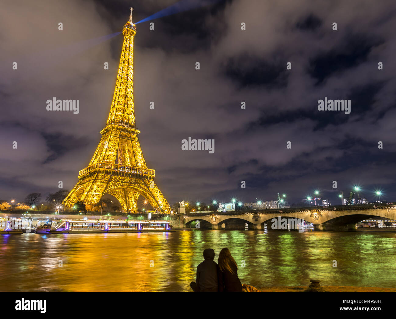 Romantic night scene in Paris at the Eiffel Tower Stock Photo