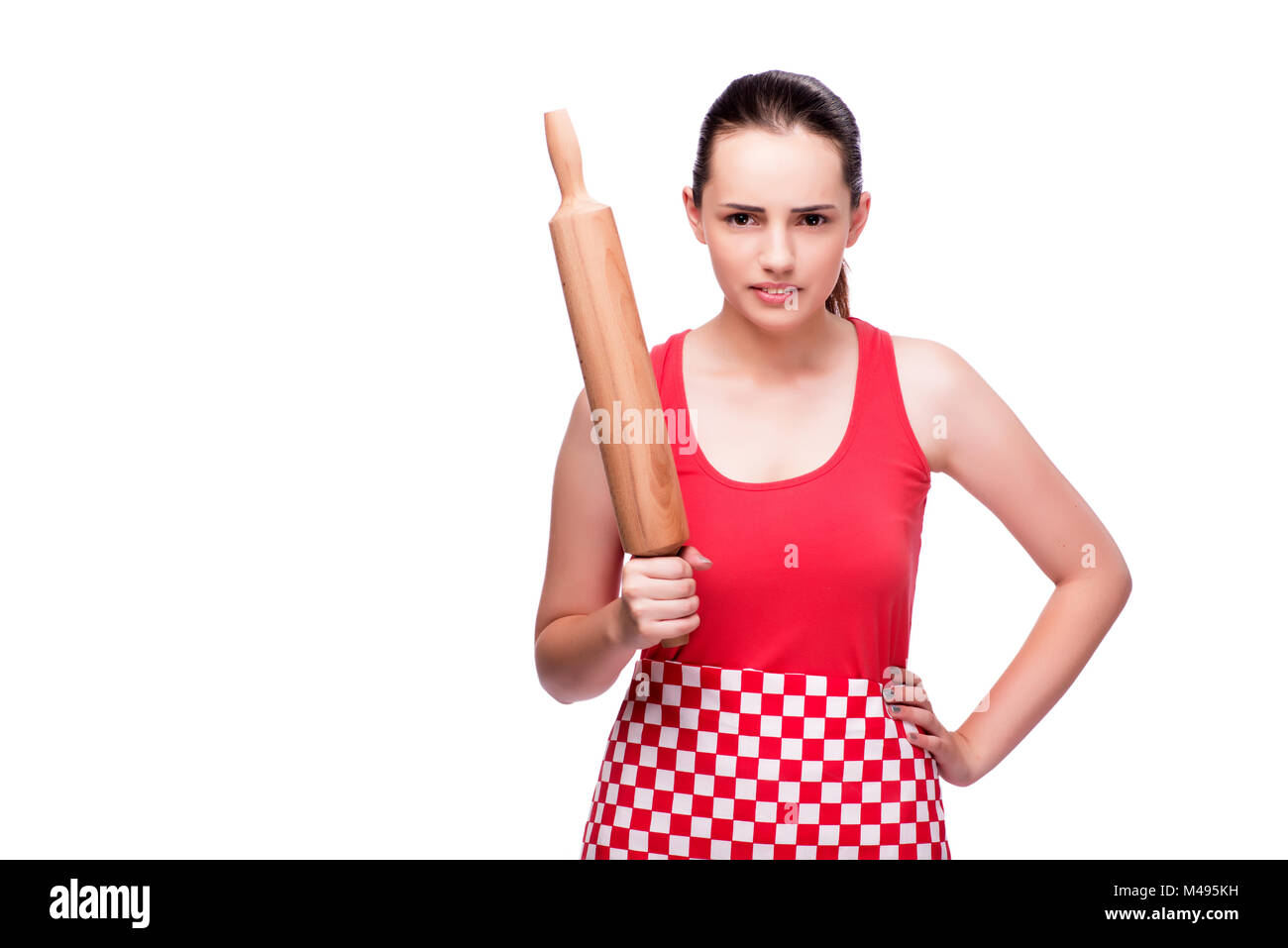 Young angry woman with rolling pin isolated on white Stock Photo