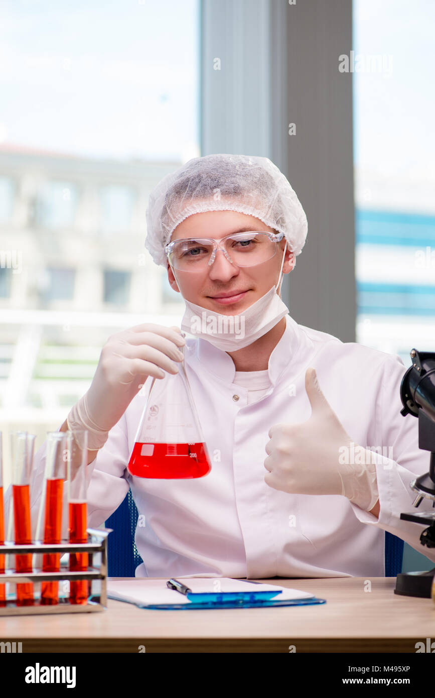 Man working in the chemical lab on science project Stock Photo Alamy