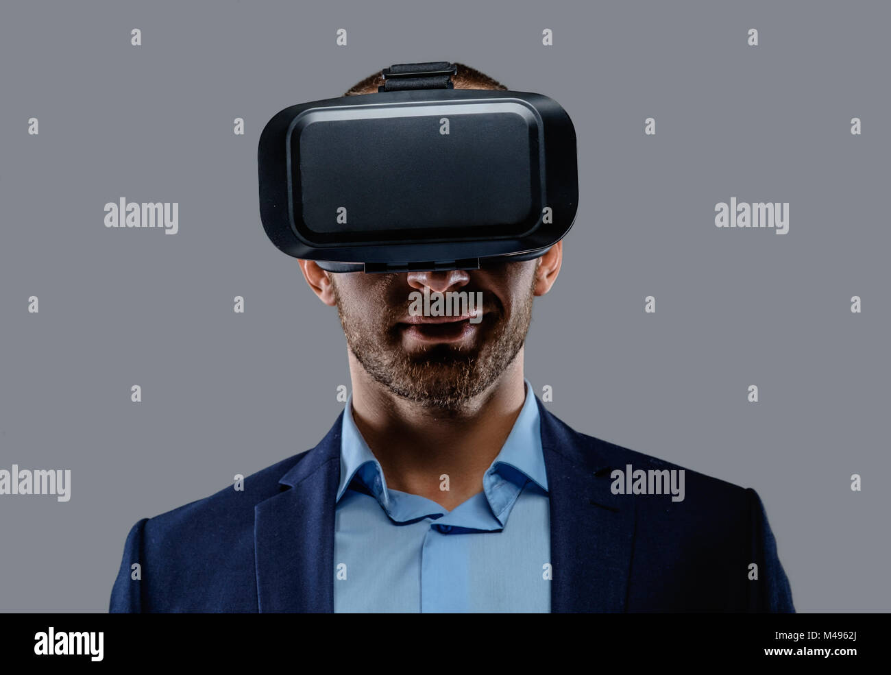 Male in a suit with virtual reality glasses on his head Stock Photo - Alamy