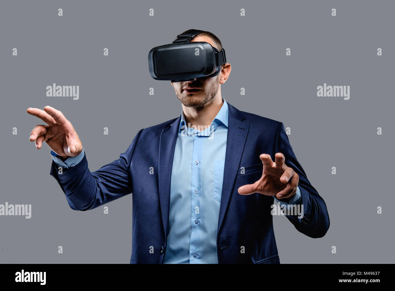 Male in a suit with virtual reality glasses on his head Stock Photo - Alamy