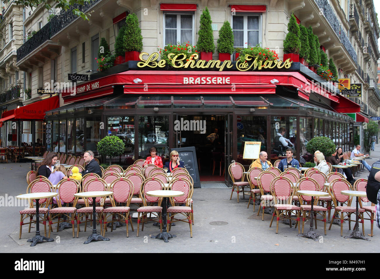 PARIS, FRANCE - JULY 21, 2011: Le Champ de Mars cafe in Paris, France. Le Champ de Mars cafe is a typical establishment for Paris, one of largest metr Stock Photo