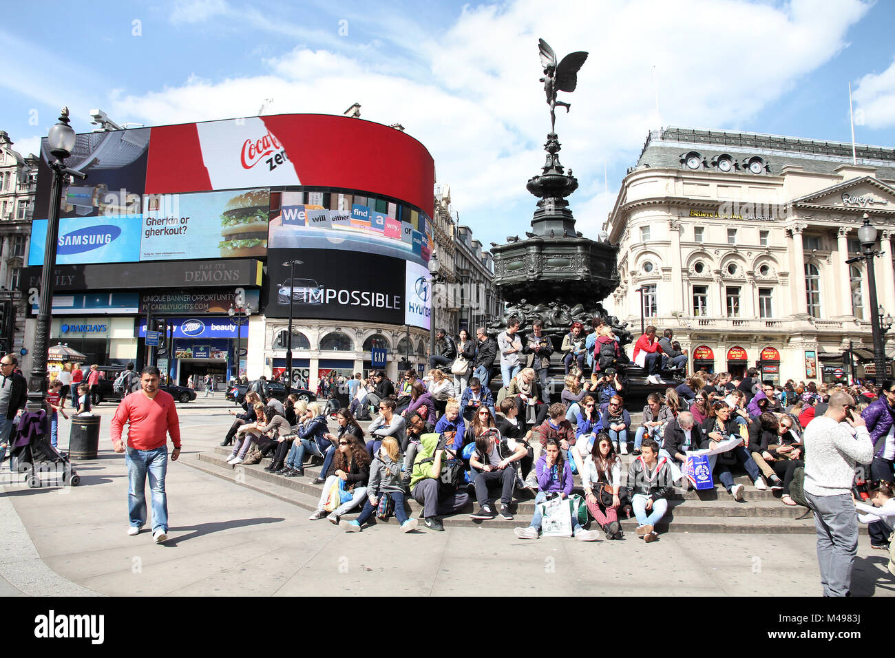 LONDON - MAY 13: People visit Piccadilly Circus on May 13, 2012 in London. With more than 14 million international arrivals in 2009, London is the mos Stock Photo