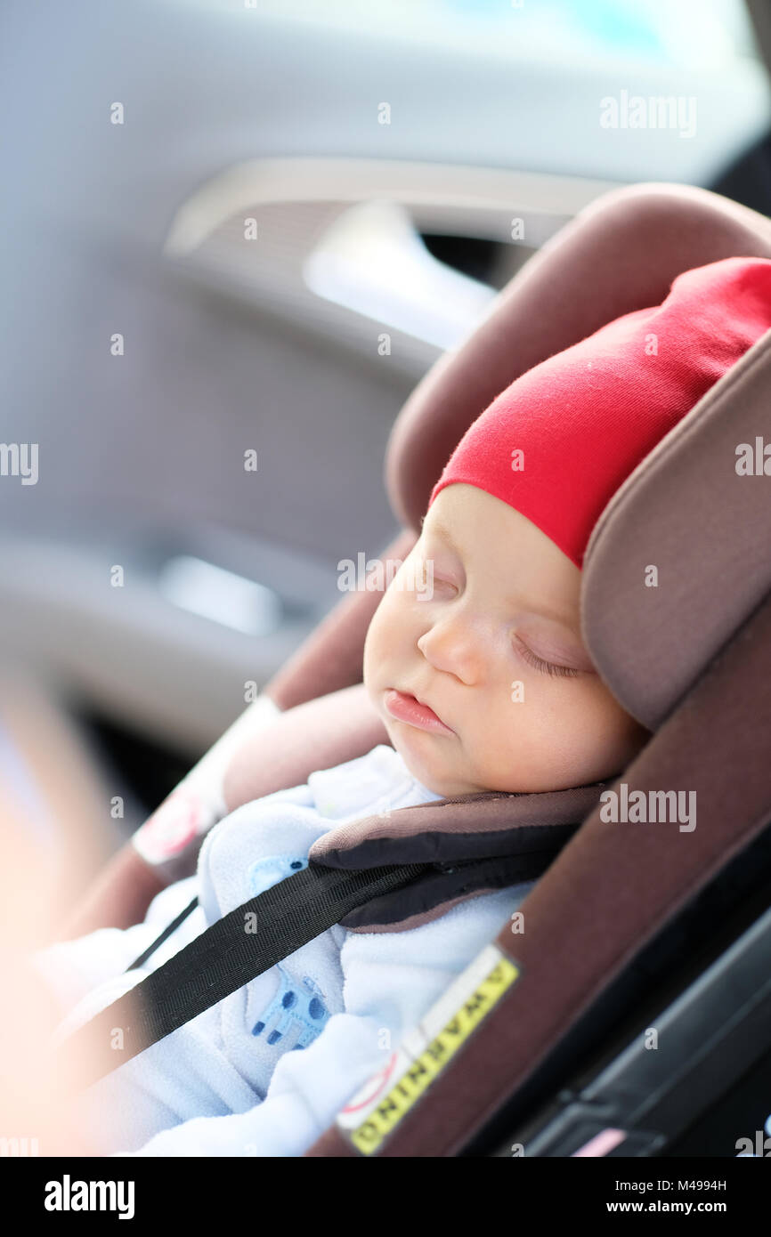 Baby sleeping in car seat Stock Photo Alamy