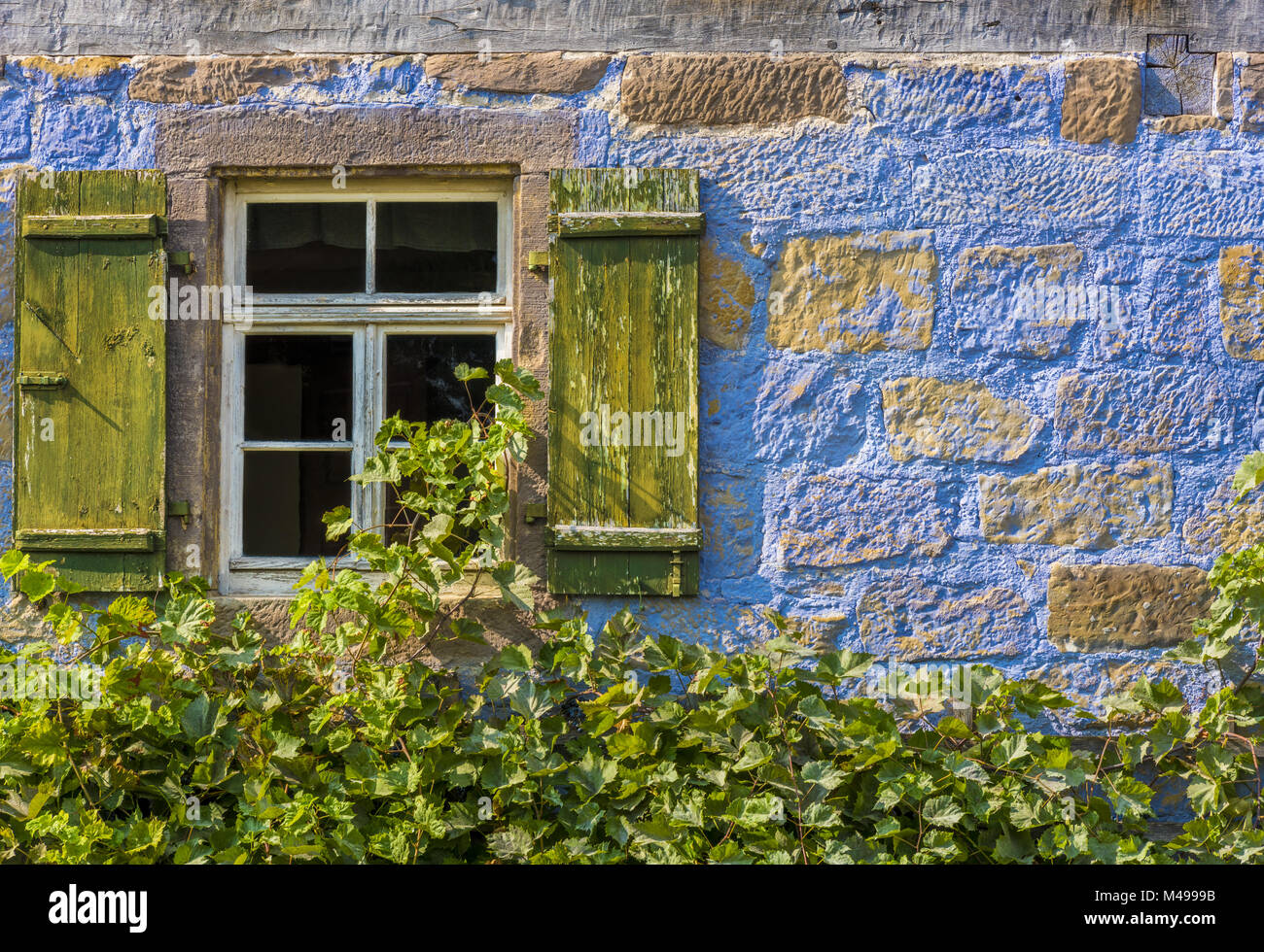 Traditional german house window and stone wall Stock Photo