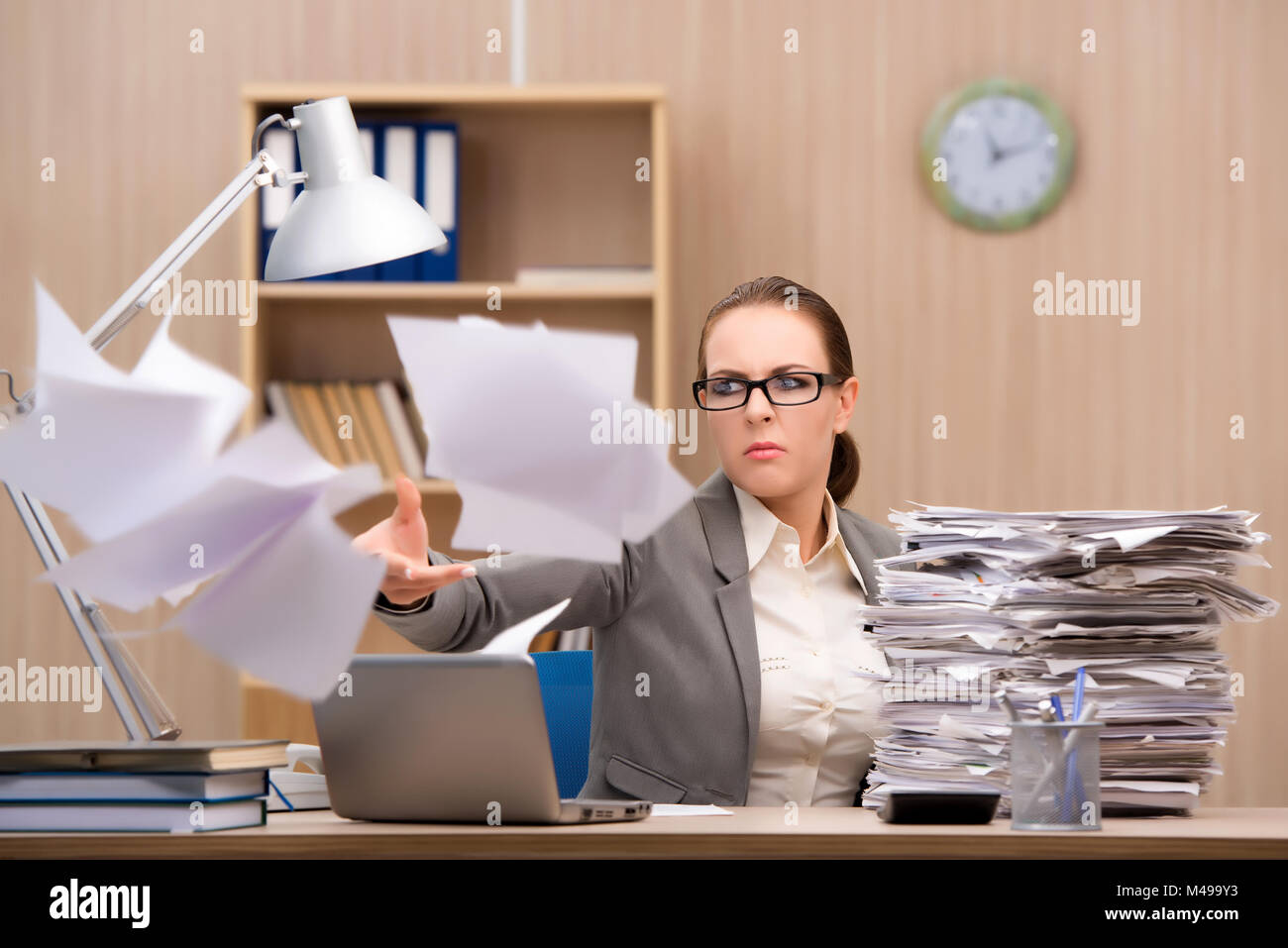 To Much Work Businesswoman under stress from too much work in the office Stock Photo ...