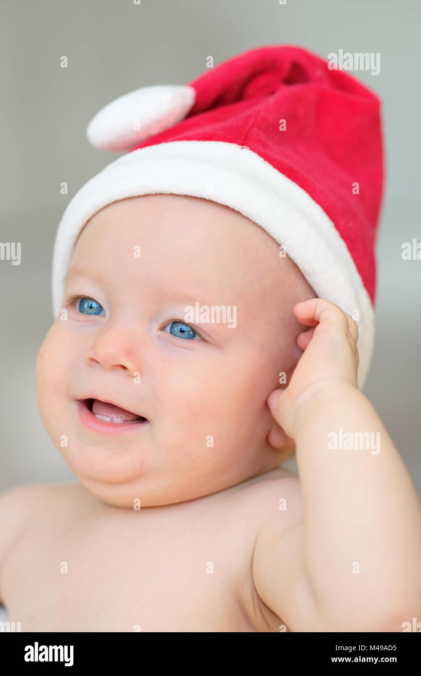 Baby christmas portrait in Santa Claus hat Stock Photo
