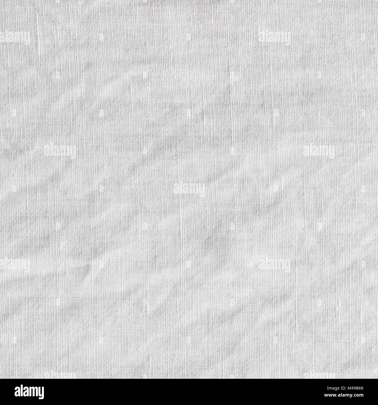 Canvas with delicate striped pattern, crumpled. Fabric texture