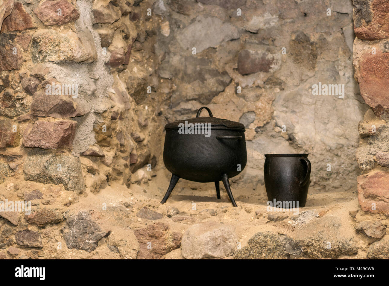 Medieval kitchen with tools, baskets, scale, fireplace Stock Photo - Alamy