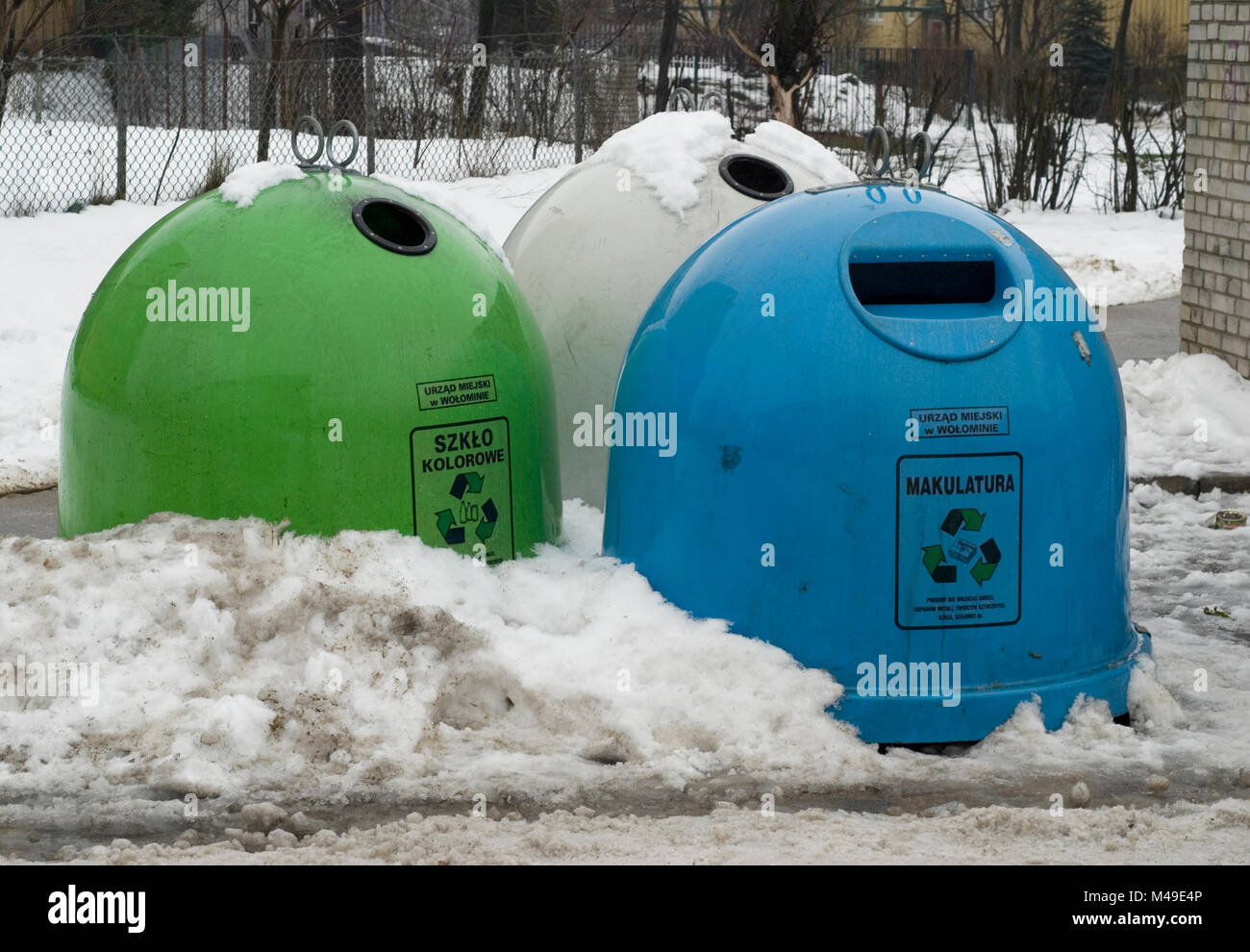 Recycling bins in the town of Wolomin in the eastern outskirts of Warsaw. January 2007 Stock Photo