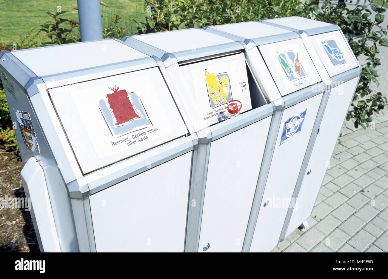 Segregated recycling bins at an Autobahn service station in German Stock Photo