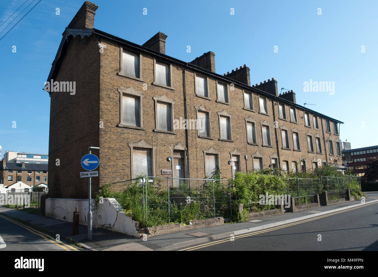 Derelict boarded up Victorian terrace houses, Maidenhead, Berkshire. Stock Photo