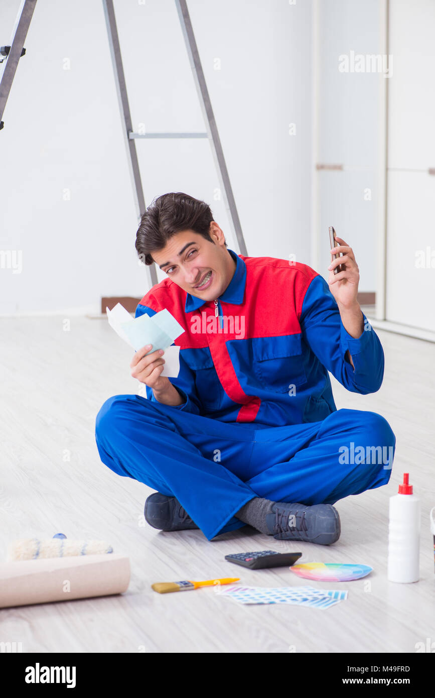 Young painter trying to match colours for painting job Stock Photo Alamy