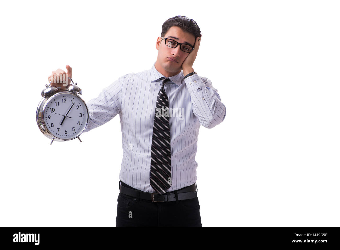 Young businessman in time management concept on white background Stock ...