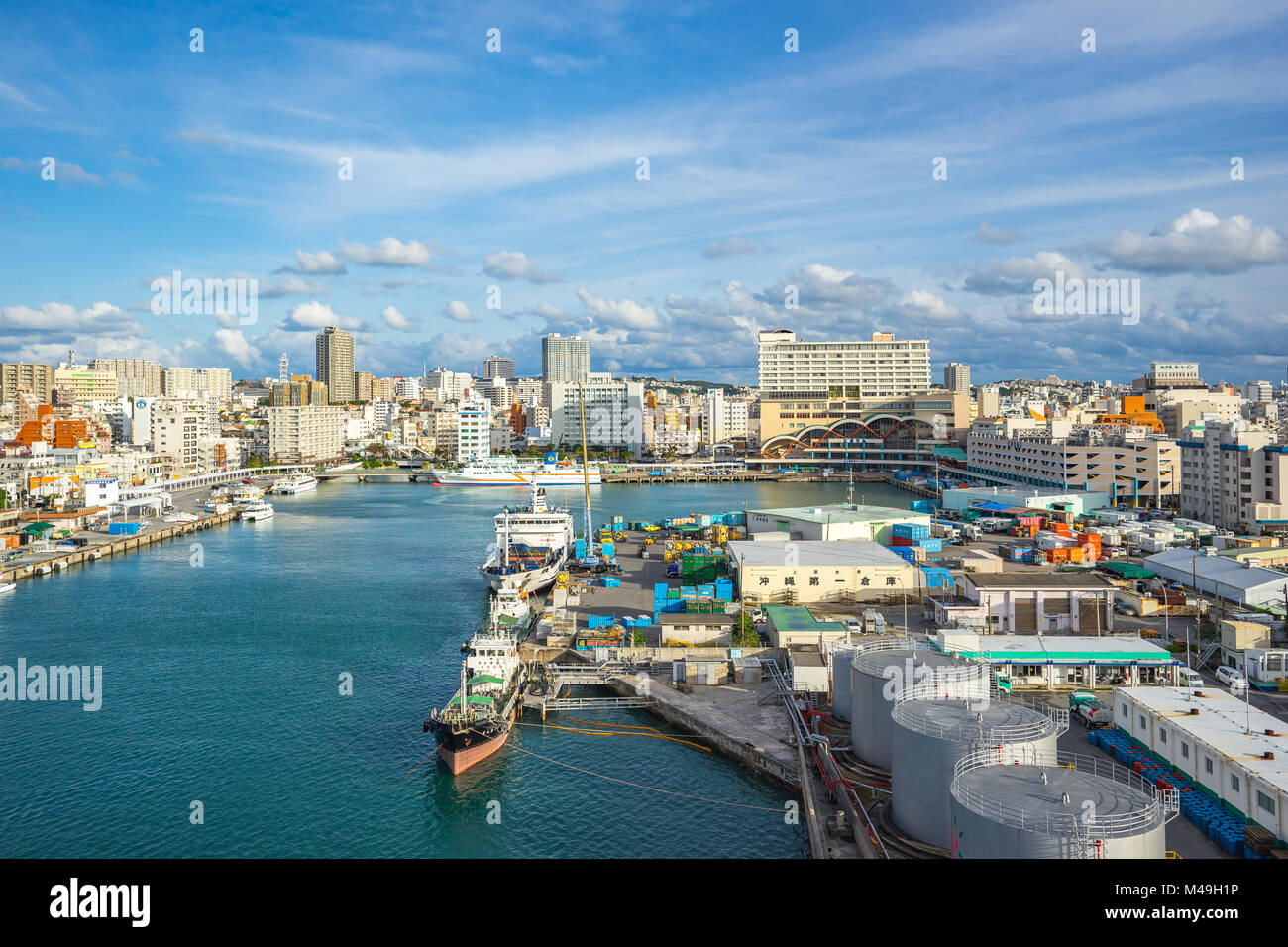 Tomari Port with Okinawa city skyline in Naha, Okinawa, Japan. Stock Photo