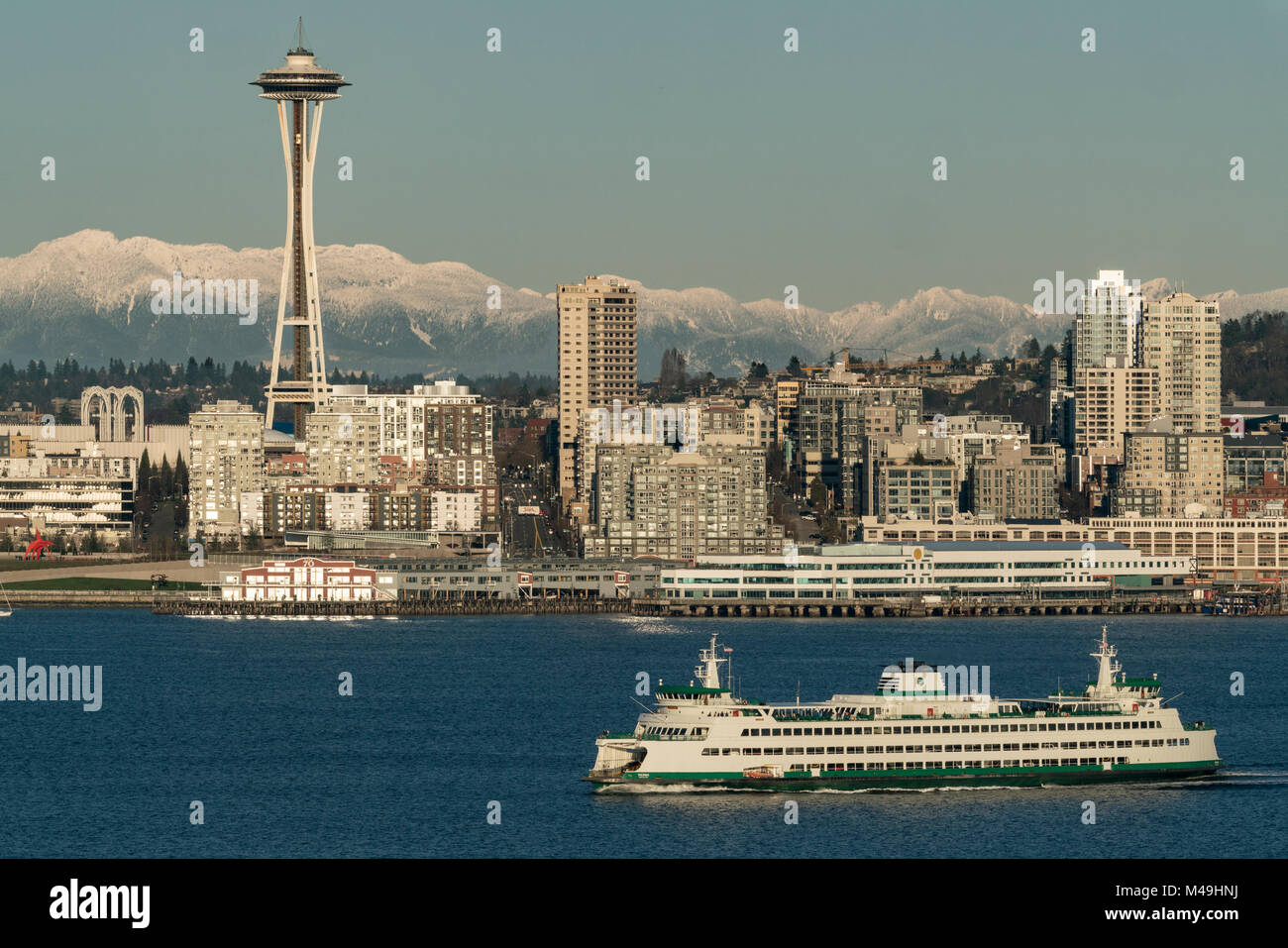 Space Needle, ferryboat, and the Cascade Mountains, Seattle, Washington, USA Stock Photo