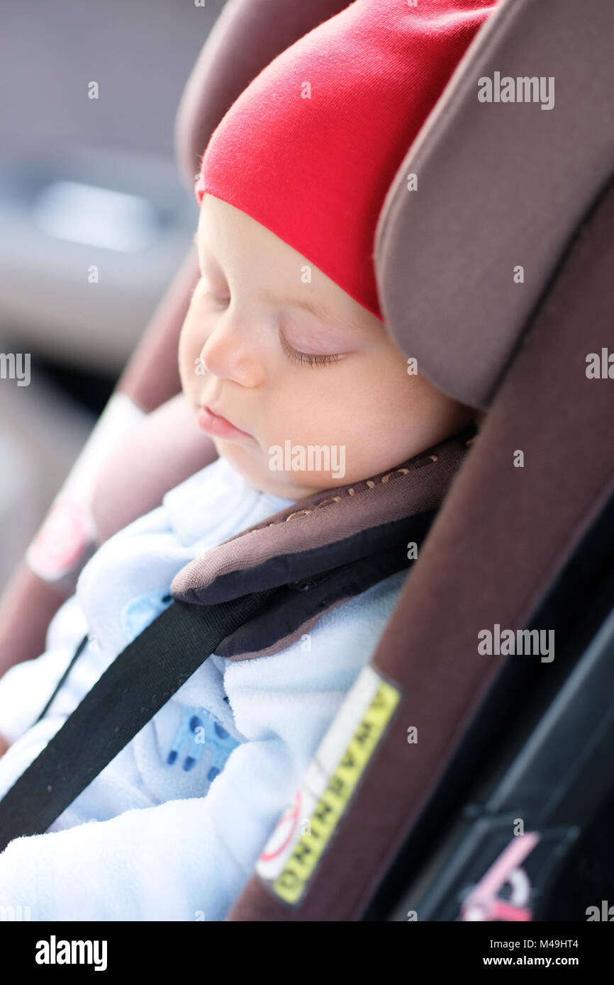Baby sleeping in car seat Stock Photo Alamy
