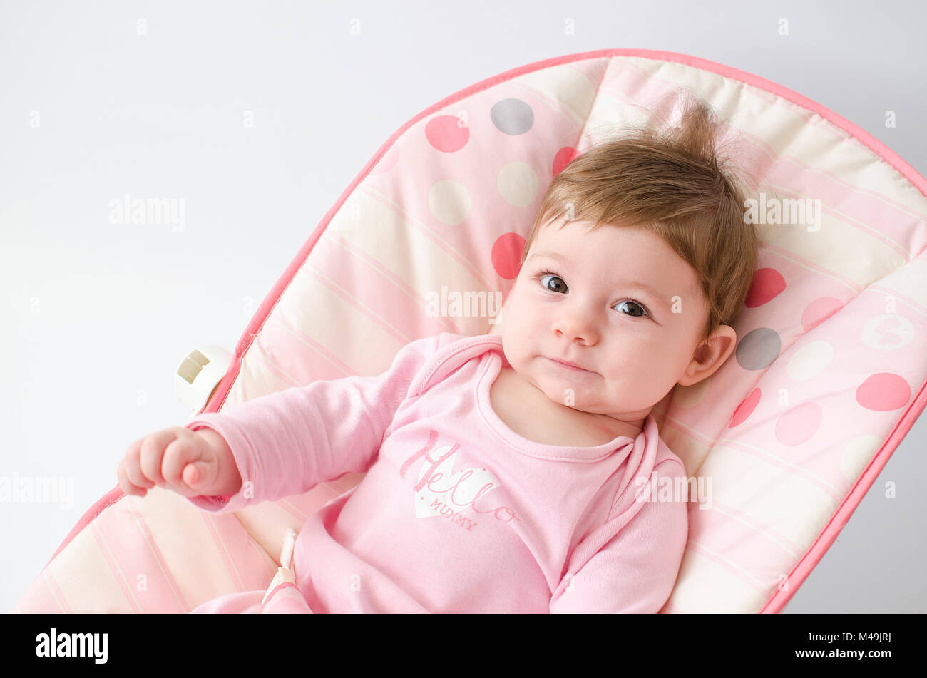 baby girl on a bouncer Stock Photo Alamy