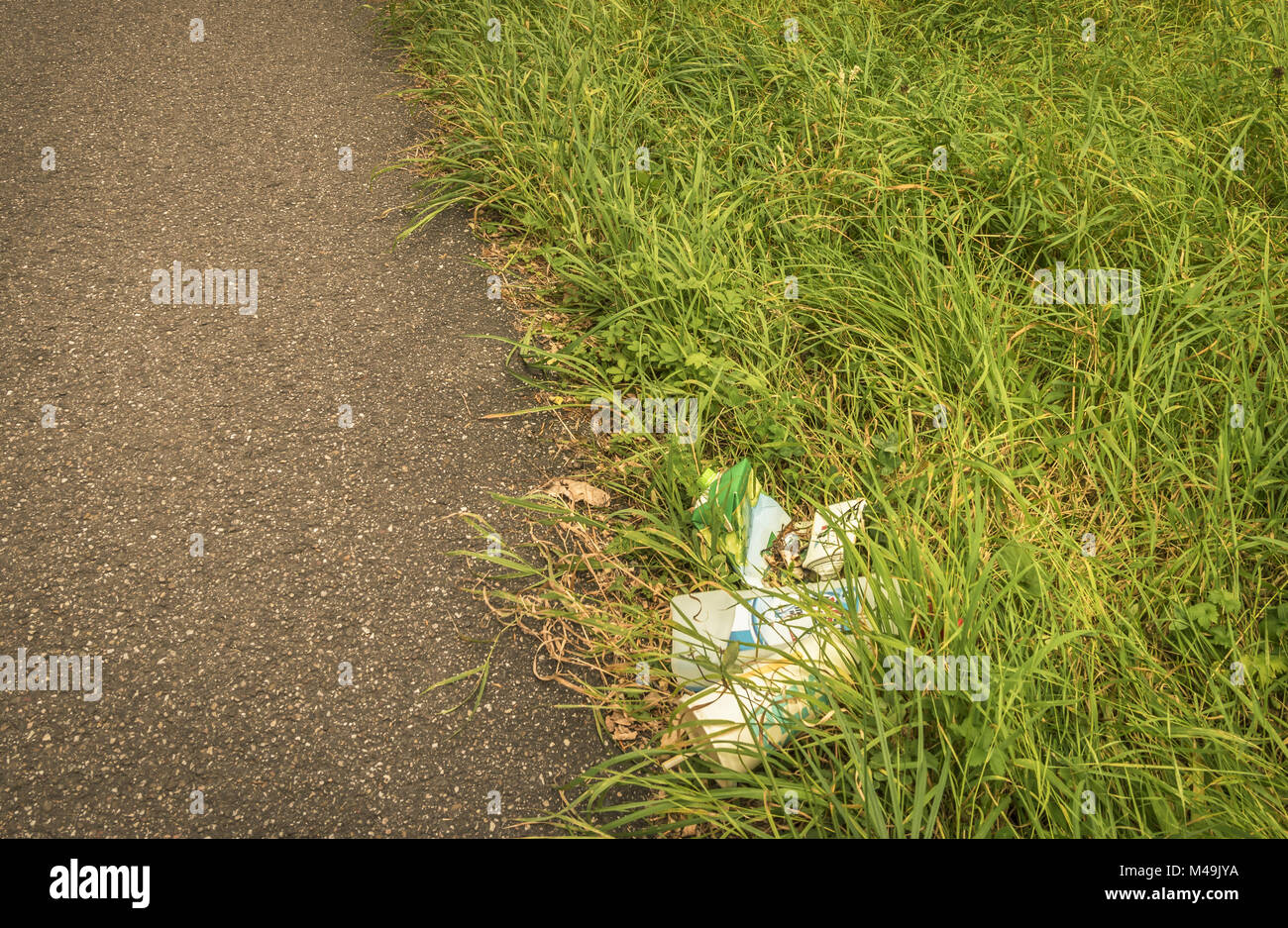 Rubbish on grass hires stock photography and images Alamy