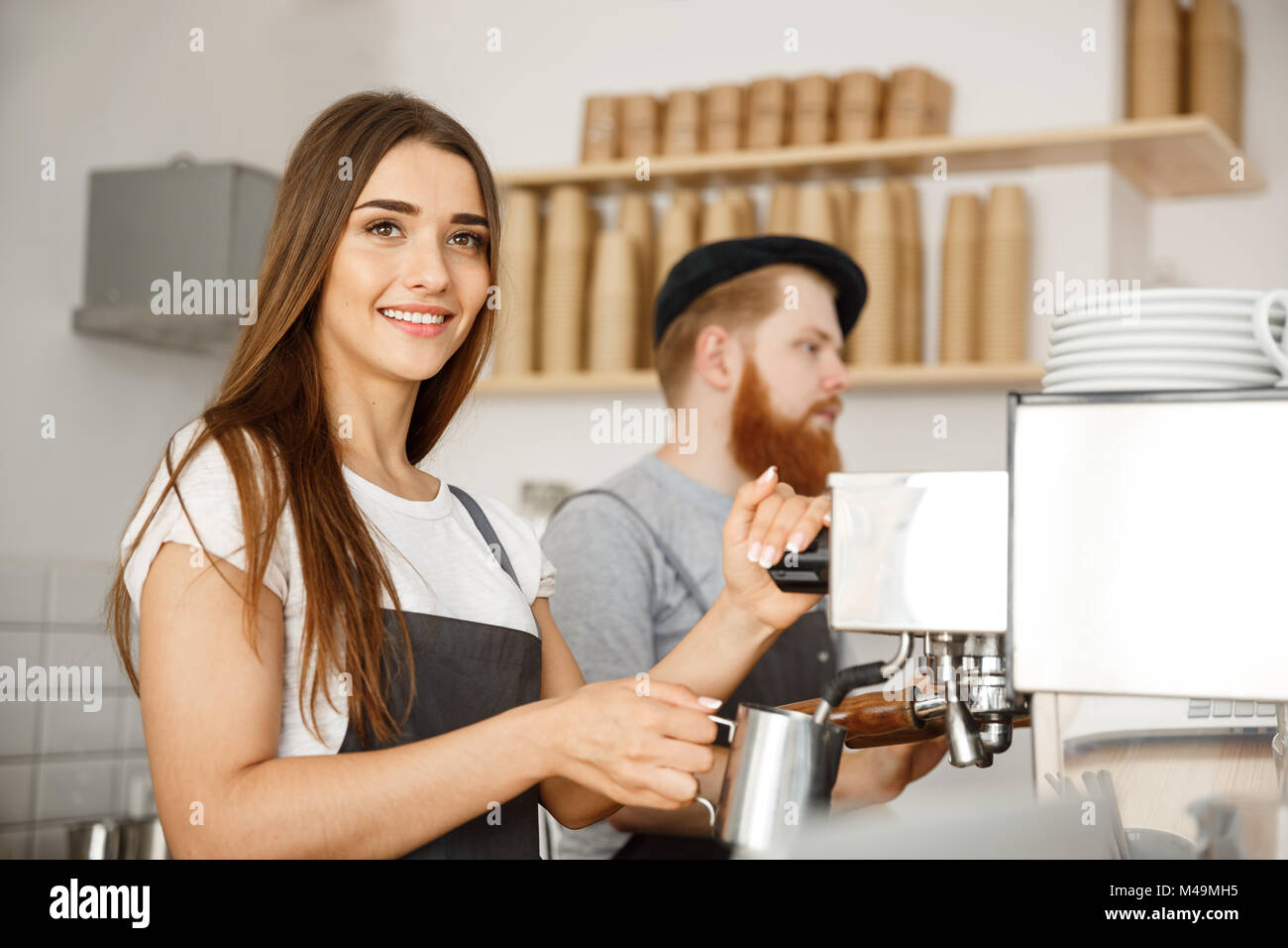 Coffee Business Concept portrait of lady barista in apron preparing