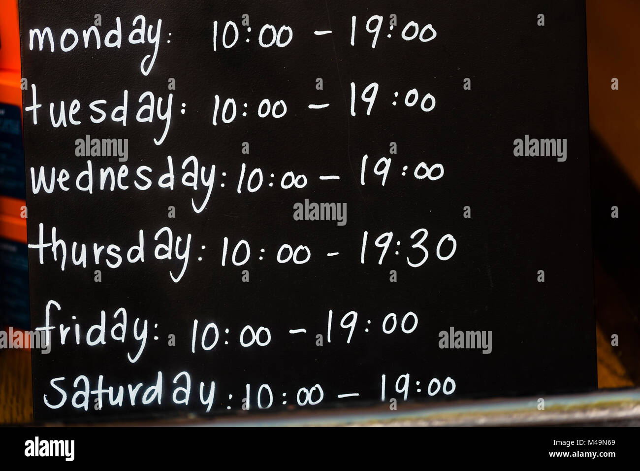 Shop opening hours sign hires stock photography and images Alamy