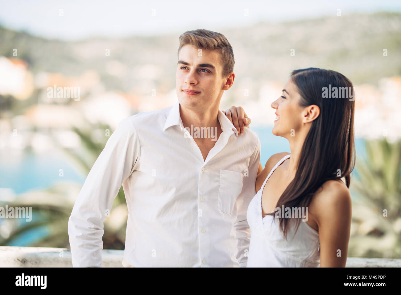 Happy couple in love on a summer holiday vacation.Celebrating holiday,anniversary,engagement. Successful man in relationship with beautiful woman.Supp Stock Photo