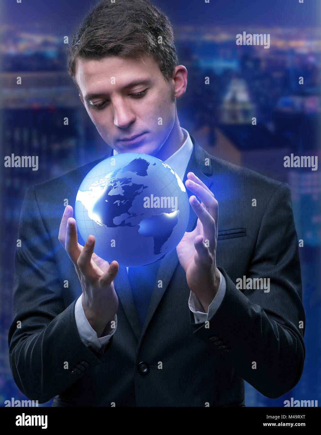 Businessman holding globe in global business concept Stock Photo - Alamy