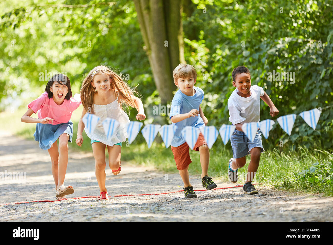 Group children from the international kindergarten makes a race Stock