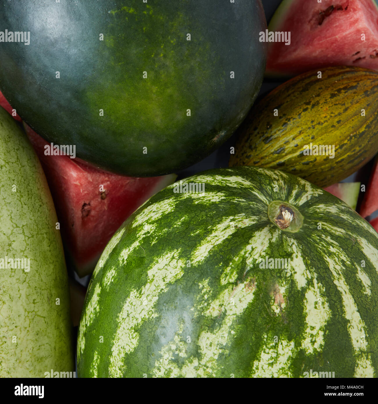 Watermelon slice with many big sweet green watermelons Stock Photo Alamy