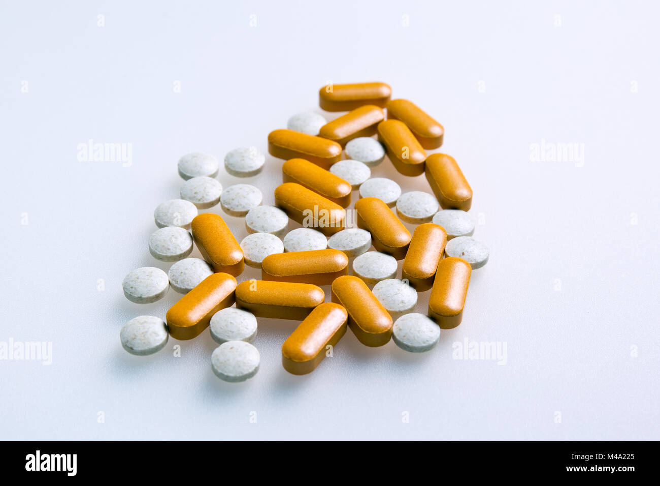 collection of pills or vitamins on a white background Stock Photo