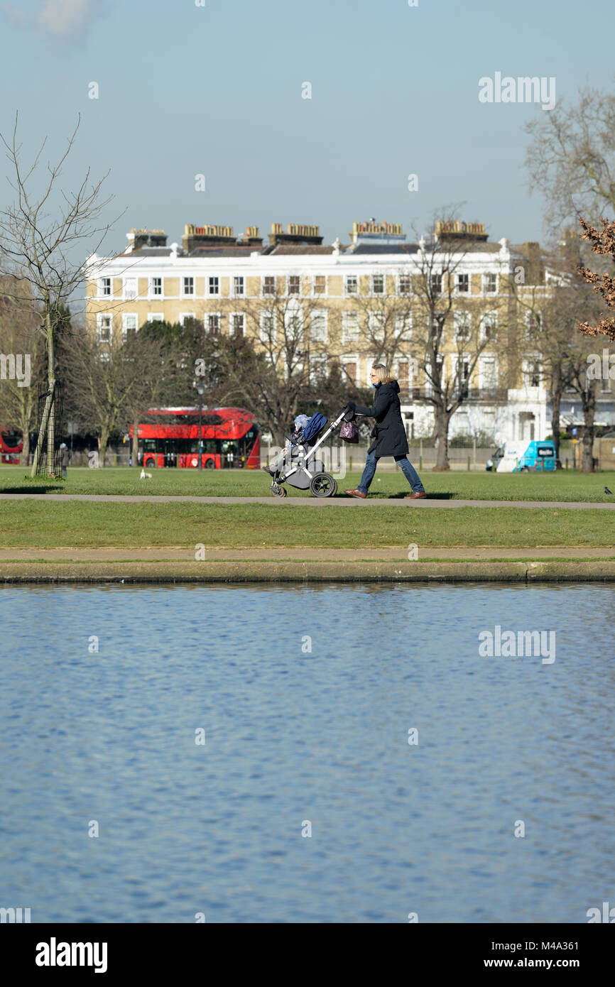 Walking with the Baby, Clapham Common, London, United Kingdom Stock Photo