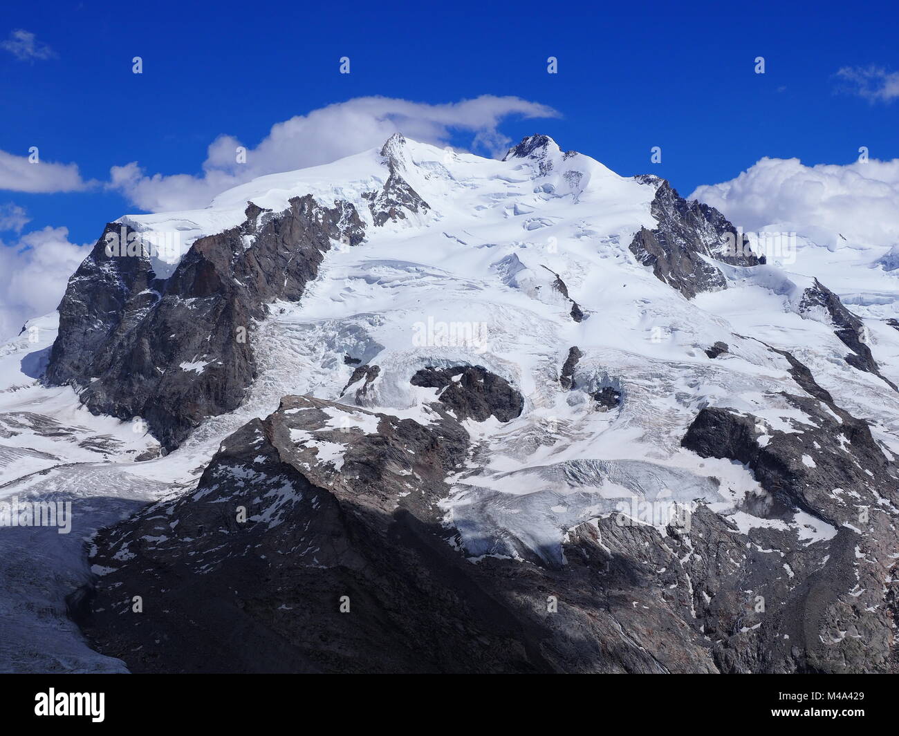 Monte Rosa, landscapes of alpine glacier and Dufourspitze highest mount in  swiss Alps at SWITZERLAND, from Gornergrat near Zermatt village, cloudy blu  Stock Photo - Alamy