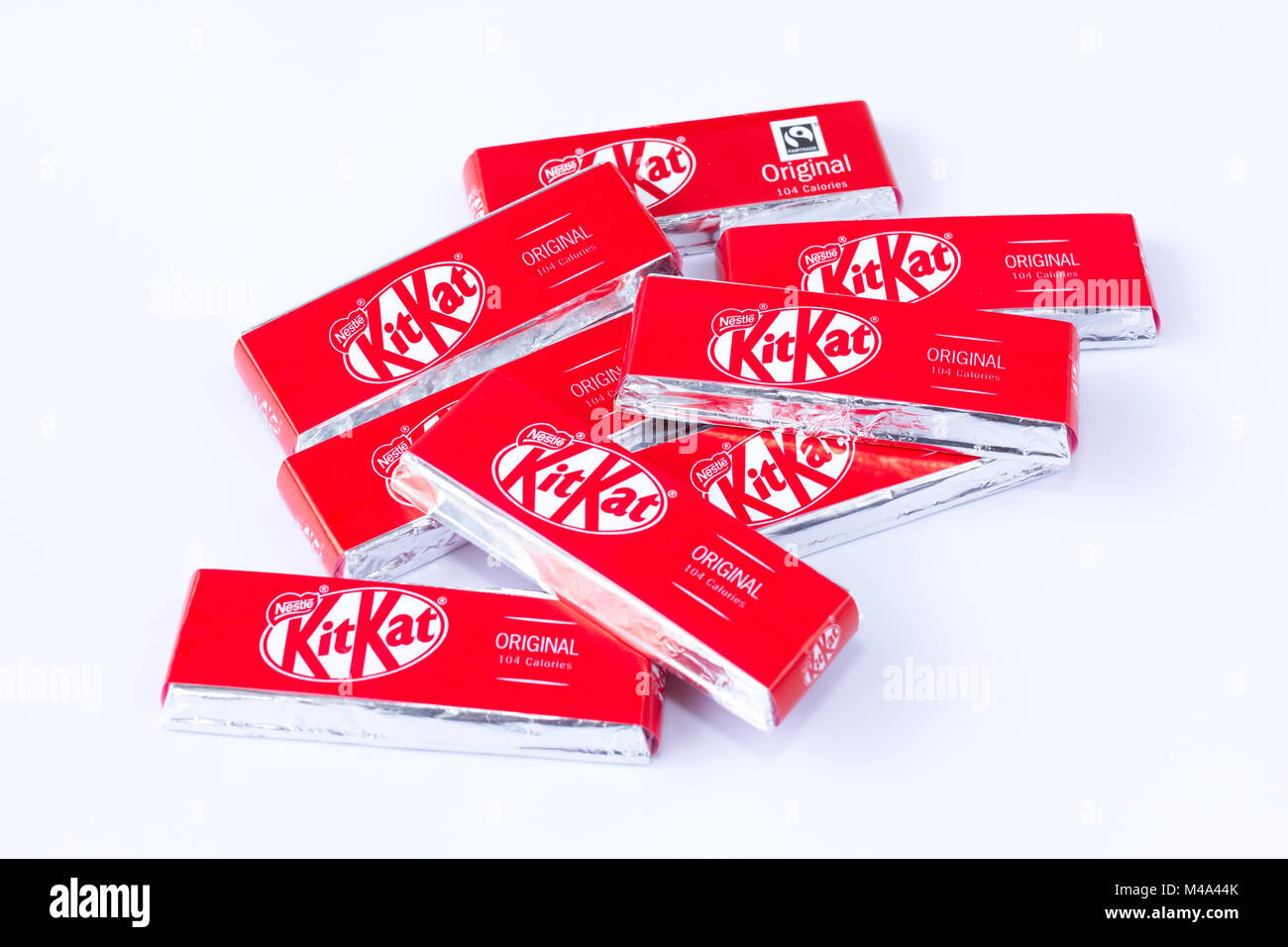 A pile of two finger Kit Kat chocolate biscuits from a multipack sold